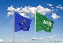 Thick colored silky flags of European Union and Saudi Arabia