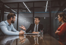 Lawyer mediating a dispute between wife and husband