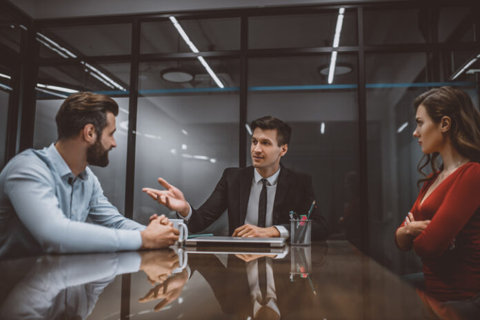 Lawyer mediating a dispute between wife and husband