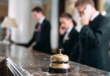 Hotel service bell at reception counter desk