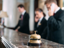 Hotel service bell at reception counter desk