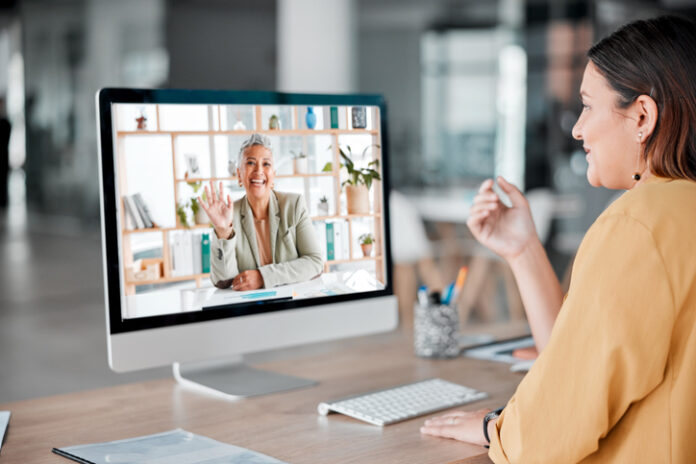 Video call, computer and business women wave in offic