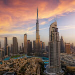 Panoramic sunrise view of the downtown district skyline of Dubai