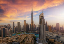 Panoramic sunrise view of the downtown district skyline of Dubai