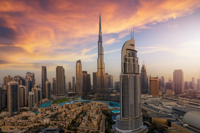 Panoramic sunrise view of the downtown district skyline of Dubai