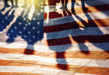 USA Flag and shadows of People