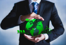 Businessman with a green globe