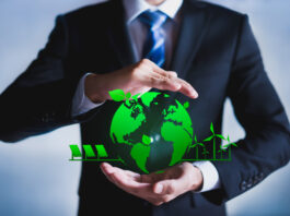 Businessman with a green globe