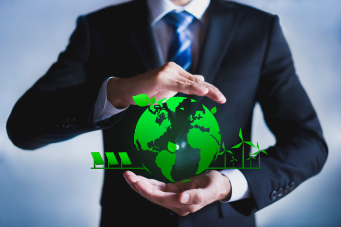 Businessman with a green globe