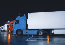 Line of Semi-Trucks with Cargo Trailer Drives Standing on the Overnight Parking Place