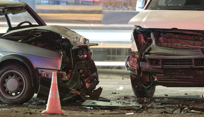 Cars crashed heavily in road accident after collision on city street at night