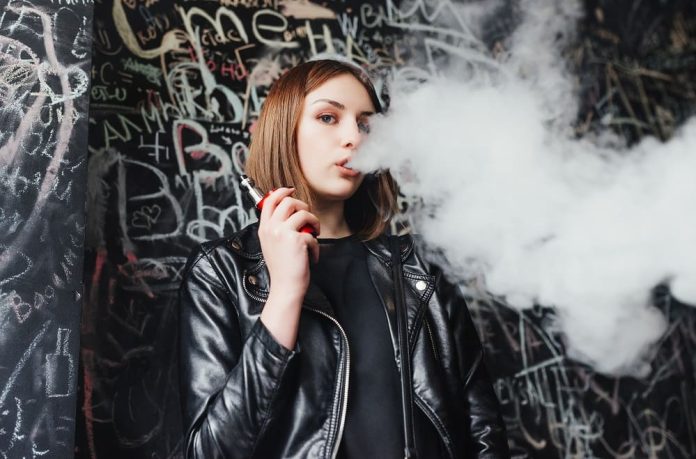 Woman using vape