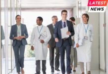 Scientists and business people walking in hallway