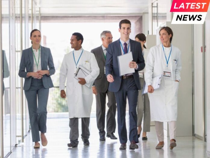 Scientists and business people walking in hallway