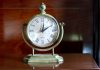 Vintage clock on the table in the bedroom