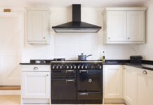 Modern modular kitchen interior, range cooker and chimney hood