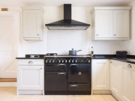 Modern modular kitchen interior, range cooker and chimney hood