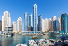 Dubai Marina skyline cityscape with yachts skyscraper buildings living at water