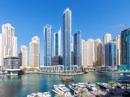 Dubai Marina skyline cityscape with yachts skyscraper buildings living at water