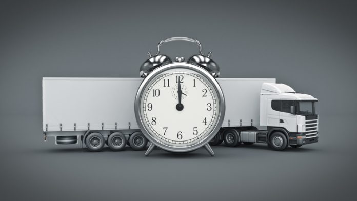 White truck with clock for delivery