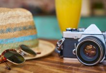 sun glasses, hat and camera for journey equipment