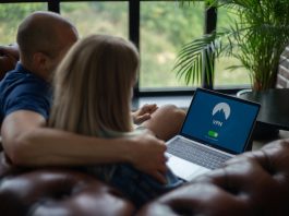 Couple using laptop with VPN on screen