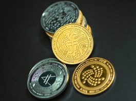 IOTA coin together on a black surface