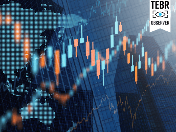 Stock market prices charts on tall buildings background.