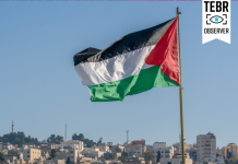 The large Palestinian flag is waiving above the city.