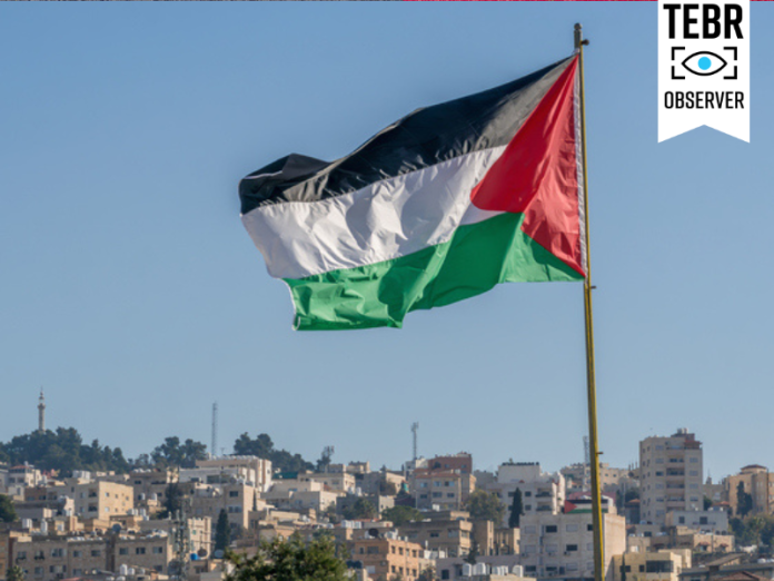 The large Palestinian flag is waiving above the city.