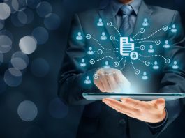 Businessman holding a tablet for Corporate data management system