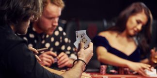 group of people playing igaming in casino together.