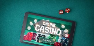 casino games online through an app with a tablet with a screen announcing that you play online casino on a table with green felt with betting chips and dice. Emotional Control in playing online casino
