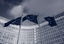 Flags of the European Union in front of the EU-commission building "Berlaymont" in Brussels, Belgium