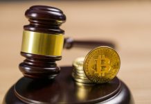 Photo of Bitcoin Regulation. BTC crypto coin and gavel on a desk.
