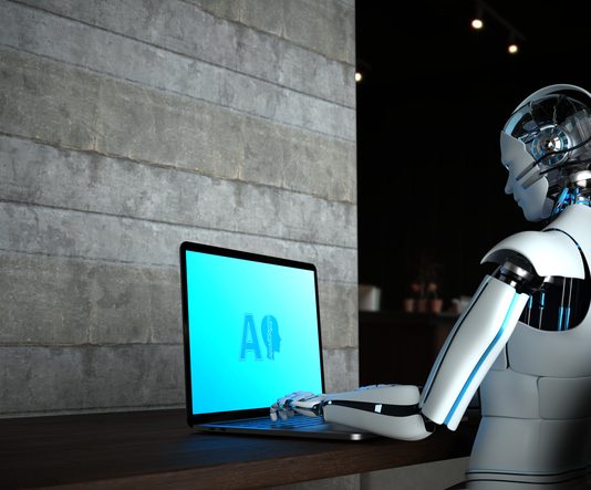 AI robot working on computer. Agentic AI concept