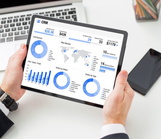 Financial advisor examining the graph on tablet