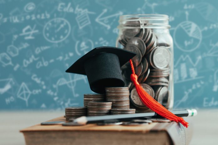 MBA cap on stack of coins