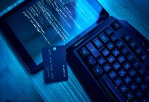 Information technology, hacking and credit card for cyber security crime in bank, phishing and software on digital tablet. Html script, screen and fintech of data fraud, password and coding on dark neon desk