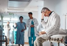 Doctor in the healthcare industry feeling tired from and emotional labor