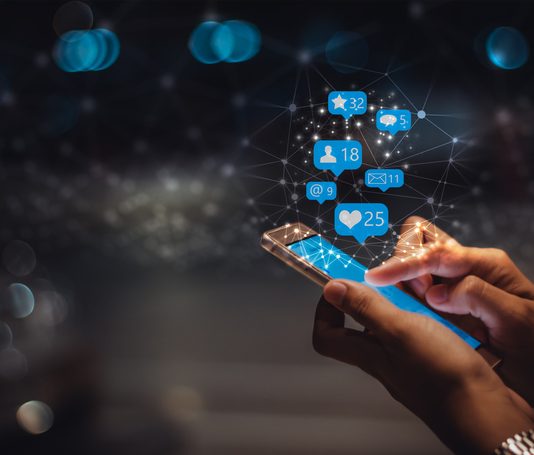 Young woman using smart phone, social media marketing , networking
