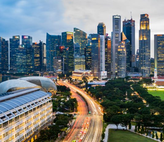 High Angle View Of Road Amidst Buildings In City Against Sky. Urban living in singapore