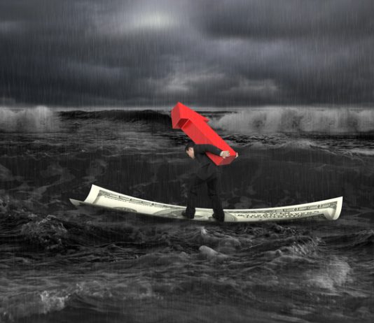 Businessman carrying red arrow up sign on money boat in dark stormy sea with waves coming. Growing business concept